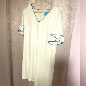 CeCe M white dress with beautiful black lining detail and bow sleeves